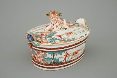 A Dutch Delft petit feu butter tub with a cow, dated 1747