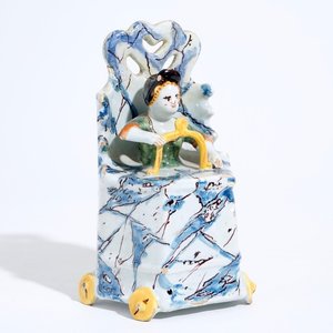 A Dutch Delft polychrome group of a child seated on a toilet, 18th C. — 照片 1