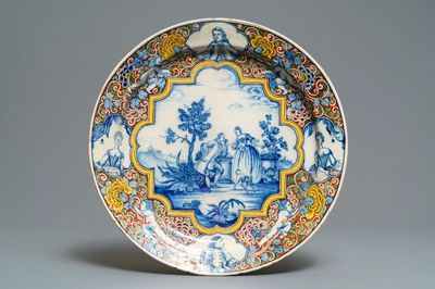 A Dutch Delft polychrome mixed technique romantic scene dish, 18th C.