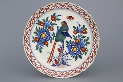 A Dutch Delft polychrome parrot plate, 18th C.