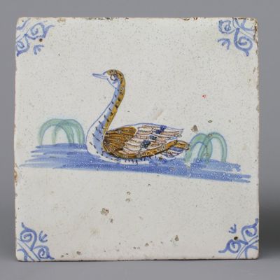A Dutch Delft polychrome tile with a swan, 17th C.