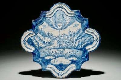A Dutch Delftware blue and white biblical plaque with "The Baptism of Christ", Amsterdam, dated 1767