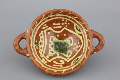A Dutch slipware porringer, dated 1611