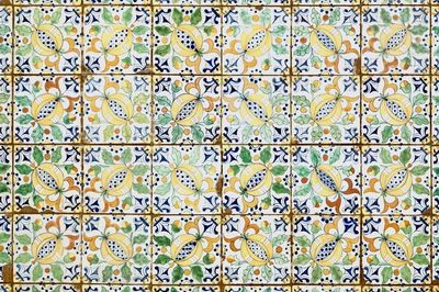 A field of 48 Dutch Delft polychrome "Pomegranate" tiles for the English market, 19th C.