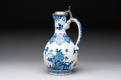 A fine blue and white Dutch Delft jug with pewter cover, early 18th C.
