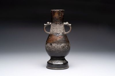 A fine Chinese archaistic bronze 'hu' vase with dragon handles, Yuan