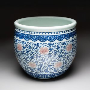 A fine Chinese blue, white and copper-red 'lotus scroll' fish bowl, Qianlong — photo 1