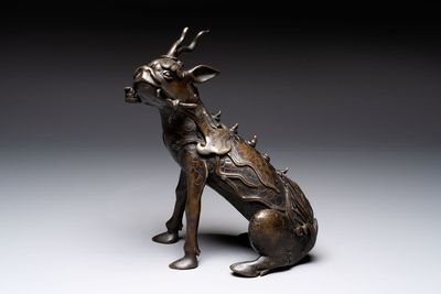 A fine Chinese bronze incense holder in the form of a qilin, Ming