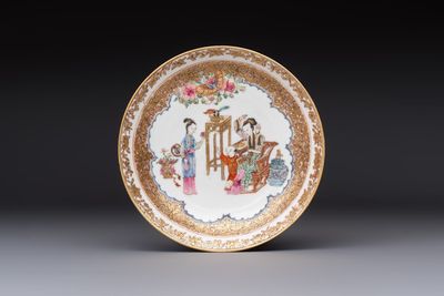 A fine Chinese Canton famille rose gilt-decorated cup and saucer with figural design, Yongzheng/Qianlong