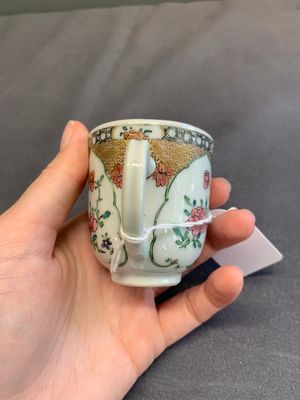 A fine Chinese famille rose armorial cup and two saucers, Yongzheng/Qianlong — photo 9