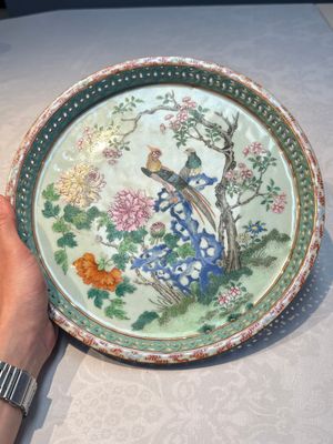 A fine Chinese famille rose pale celadon-ground 'phoenixes' dish with a reticulated rim, Qianlong — photo 1