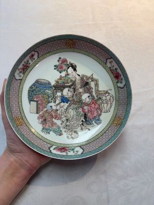 A fine Chinese famille rose ruby-back 'lady and boys' eggshell plate, Yongzheng — photo 1