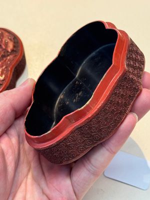 A fine Chinese red cinnabar lacquer ruyi-form 'Ba Man Xian Bao 八蠻獻寶' box and cover, Qianlong — photo 14
