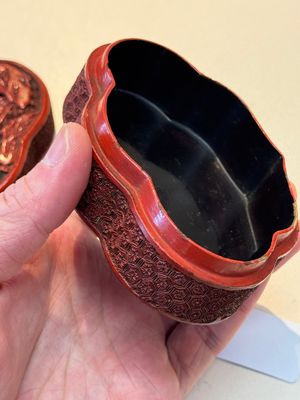 A fine Chinese red cinnabar lacquer ruyi-form 'Ba Man Xian Bao 八蠻獻寶' box and cover, Qianlong — photo 15