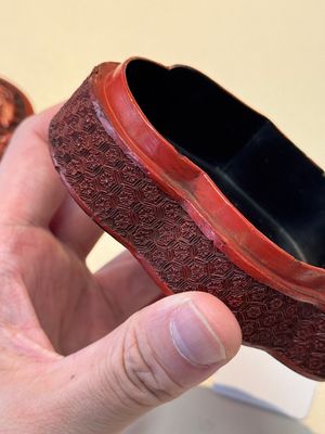 A fine Chinese red cinnabar lacquer ruyi-form 'Ba Man Xian Bao 八蠻獻寶' box and cover, Qianlong — photo 17