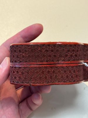 A fine Chinese red cinnabar lacquer ruyi-form 'Ba Man Xian Bao 八蠻獻寶' box and cover, Qianlong — photo 3