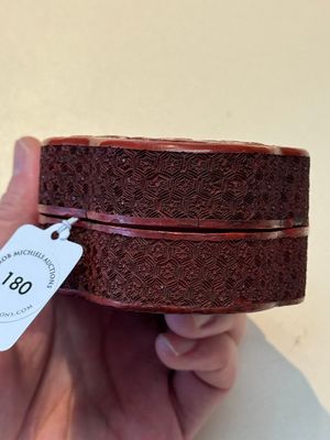A fine Chinese red cinnabar lacquer ruyi-form 'Ba Man Xian Bao 八蠻獻寶' box and cover, Qianlong — photo 5