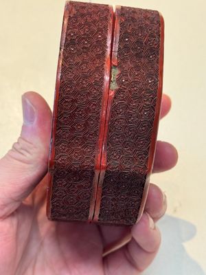 A fine Chinese red cinnabar lacquer ruyi-form 'Ba Man Xian Bao 八蠻獻寶' box and cover, Qianlong — photo 6