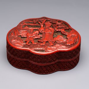 A fine Chinese red cinnabar lacquer ruyi-form 'Ba Man Xian Bao 八蠻獻寶' box and cover, Qianlong — photo 2