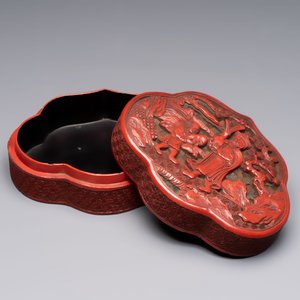 A fine Chinese red cinnabar lacquer ruyi-form 'Ba Man Xian Bao 八蠻獻寶' box and cover, Qianlong — photo 3