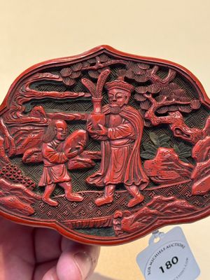 A fine Chinese red cinnabar lacquer ruyi-form 'Ba Man Xian Bao 八蠻獻寶' box and cover, Qianlong — photo 8