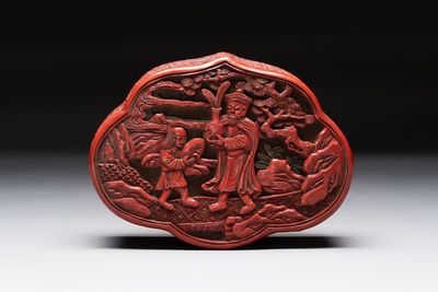 A fine Chinese red cinnabar lacquer ruyi-form 'Ba Man Xian Bao 八蠻獻寶' box and cover, Qianlong