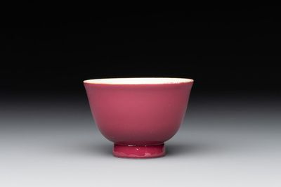 A fine Chinese ruby-ground famille rose 'magnolia' cup, Qianlong mark and of the period
