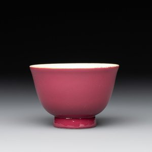 A fine Chinese ruby-ground famille rose 'magnolia' cup, Qianlong mark and of the period — photo 1