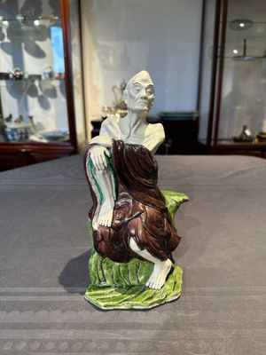 A fine Chinese sancai-glazed figure of a Luohan, Qianlong — photo 1