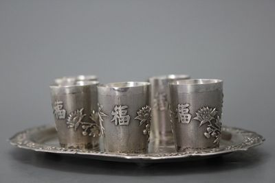 A fine Chinese silver tray with cups, 19th C.
