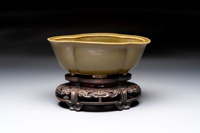 A fine Chinese teadust-glazed quadrifoil jardinière with an openworked wooden stand, Yongzheng mark and of the period