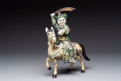 A fine Chinese verte biscuit sculpture of a Heavenly King on horseback, 19th C.