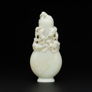 A fine Chinese white jade 'Buddhist lions' vase and cover, Qing — photo 1