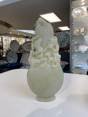 A fine Chinese white jade 'buddhist lions' vase and cover, Qing — photo 1
