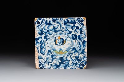 A fine Dutch Delft polychrome maiolica tile with a cherub, ca. 1600