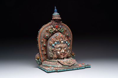 A fine large Nepalese red coral and precious stone-inset brass and silver filigree 'Bhairava' mask, 19th C.