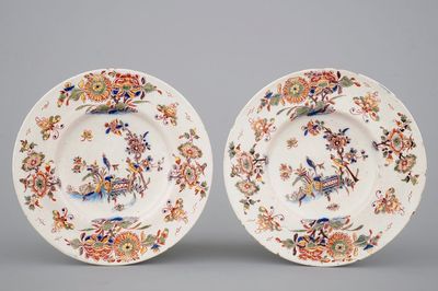 A fine pair of polychrome Dutch Delft plates with birds among flowers, early 18th C.