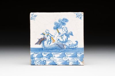 A fine partly polychrome, blue and white Dutch Delft 'sea creature with putti' tile, early 18th C.