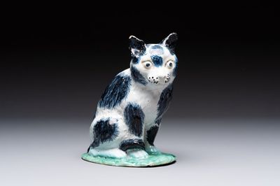 A fine polychrome Brussels faience model of a cat, 18th C.