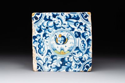 A fine polychrome Dutch Delft maiolica tile with a cherub, ca. 1600