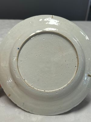 A fine polychrome Dutch Delft plate with floral design — photo 13