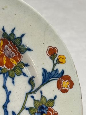 A fine polychrome Dutch Delft plate with floral design — photo 6