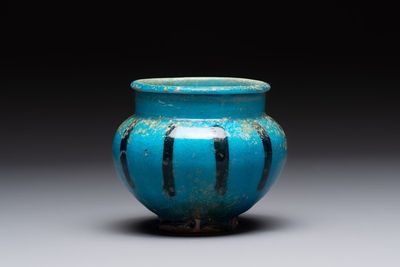 A fine Raqqa turquoise-glazed striped jar, Syria, 13th C.