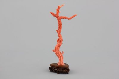 A fine sculpted Chinese red coral branch with a Guanyin, birds and flowers, 19th C.