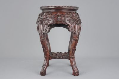 A finely carved Chinese hardwood marble top vase stand, 19th C.