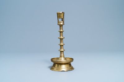 A Flemish or Dutch knotted bronze candlestick, 15th C.