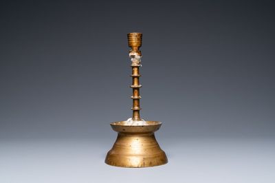 A Flemish or Dutch knotted bronze candlestick, 15th C.