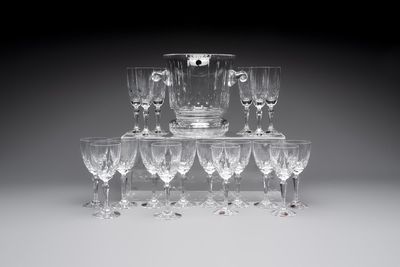 A French crystal wine cooler, six champagne flutes, six wine glasses and six water glasses, in original Arnauld de Brissac boxes, 1970s