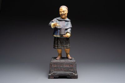 A French papier-mâché figure of a mandarin, inscribed 'Compagnie Française Des Chocolats et Des Thés', 20th C.