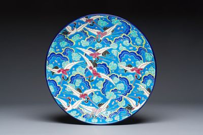 A French polychrome enamelled Longwy 'Cranes among Clouds' charger, 20th C.